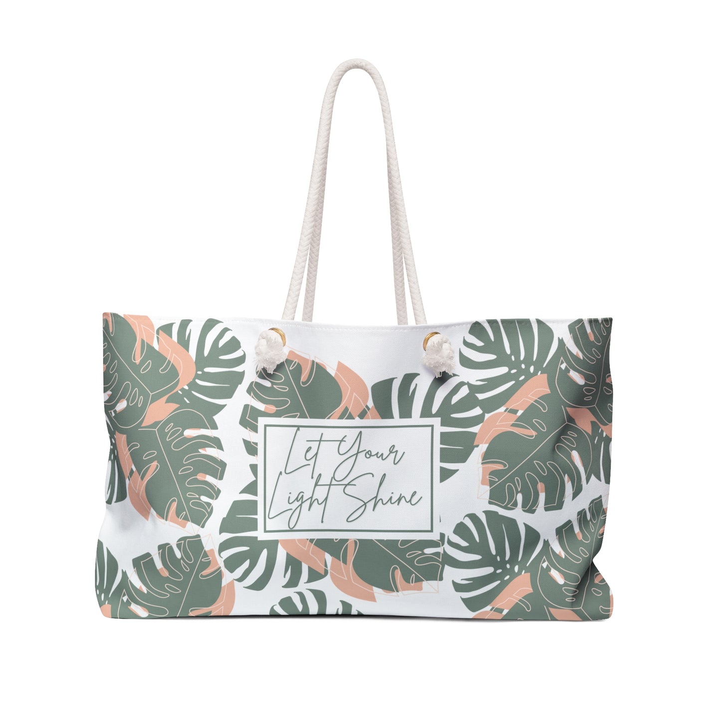A weekender tote bag with a leaf pattern and a text panel that reads 'Let Your Light Shine'. The bag has rope handles and a cream interior lining.