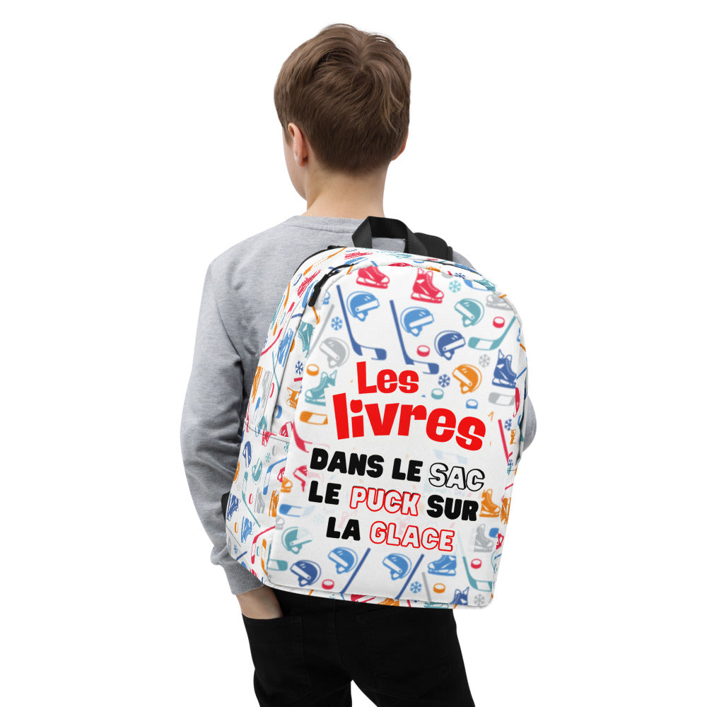 Child wearing a colorful backpack with text and graphics on a white background