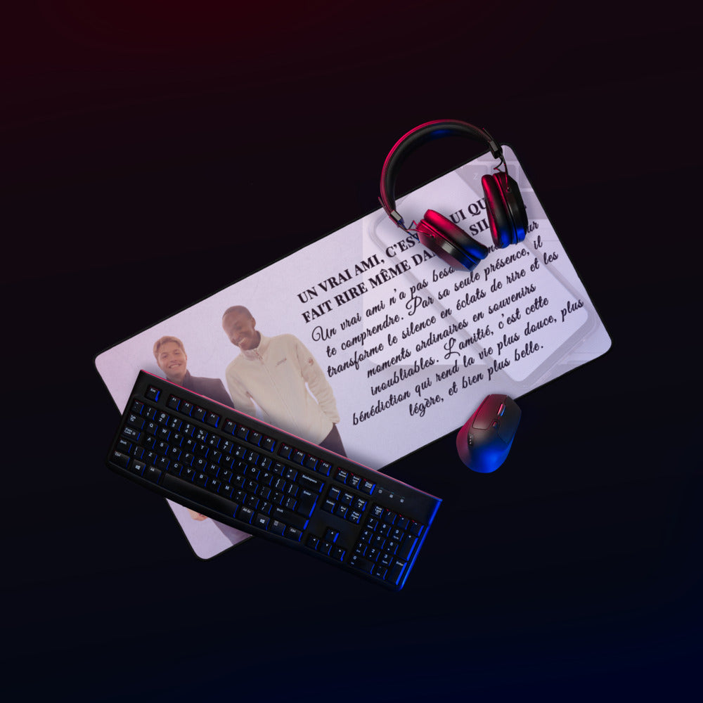 Keyboard, mouse, and headphones on a desk with a dark background