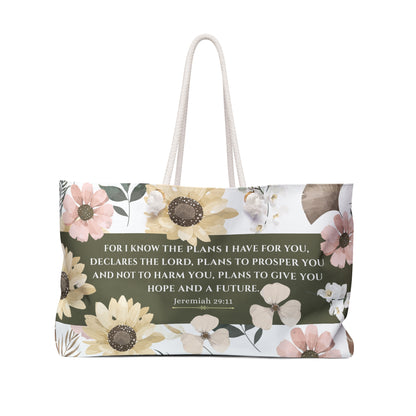 Floral-patterned bag with inspirational quote on a white background