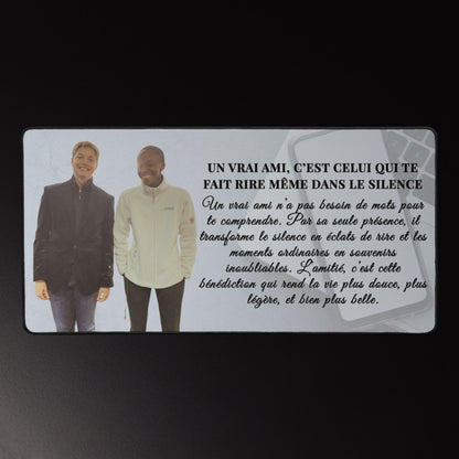 Desk Mat with two people standing together and a French quote on a dark background